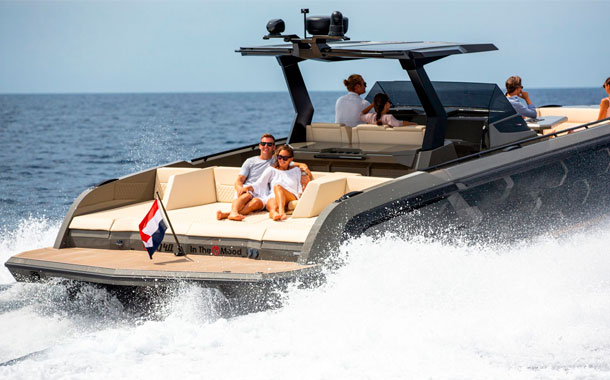 A family enjoying its Vanquish Yacht in Ibiza